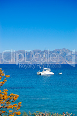 Turquoise Aegean Sea and luxury yacht, Crete, Greece