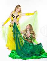 two girl dance with veil