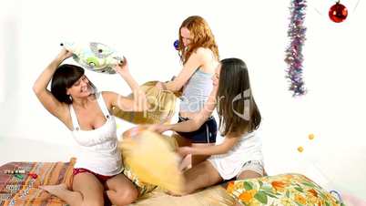 Young beauty girls fight with pillow