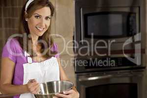 Woman Mixing and Baking In Kitchen
