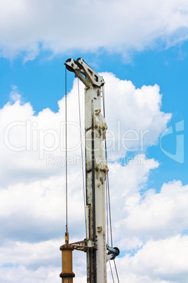 Auger part over blue sky with clouds