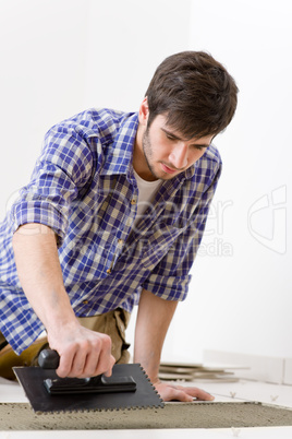 Home improvement - handyman laying tile