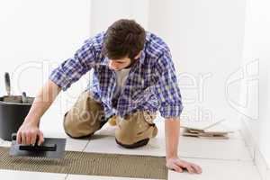 Home improvement - handyman laying tile