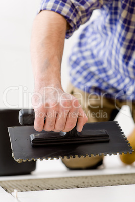 Home improvement - handyman laying tile