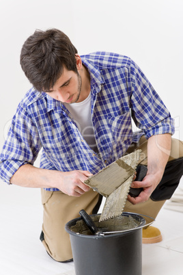 Home improvement - handyman laying tile