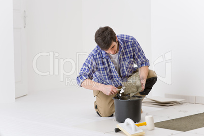 Home improvement - handyman laying tile