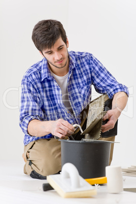 Home improvement - handyman laying tile