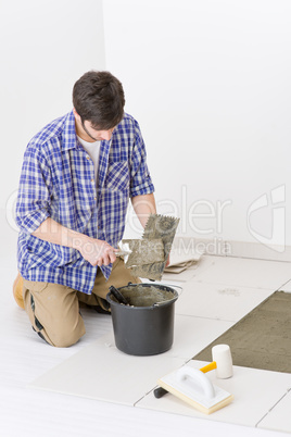 Home improvement - handyman laying tile Home improvement - handyman laying tile