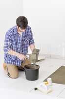 Home improvement - handyman laying tile