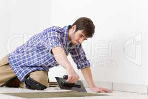 Home improvement - handyman laying tile