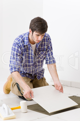 Home improvement - handyman laying tile