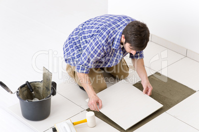 Home improvement - handyman laying tile