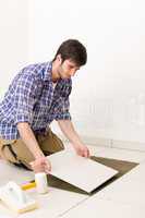 Home improvement - handyman laying tile