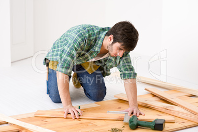 Home improvement - handyman installing wooden floor