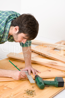 Home improvement - handyman installing wooden floor