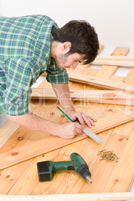 Home improvement - handyman installing wooden floor