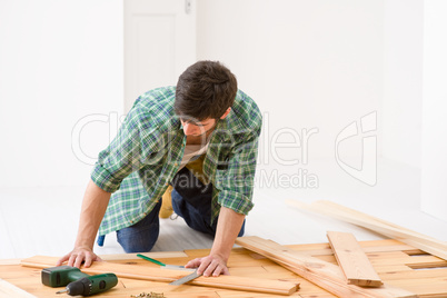 Home improvement - handyman installing wooden floor