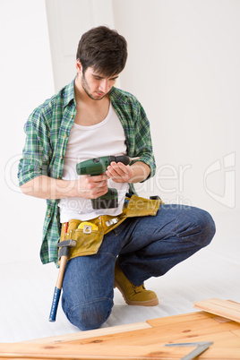 Home improvement - handyman installing wooden floor