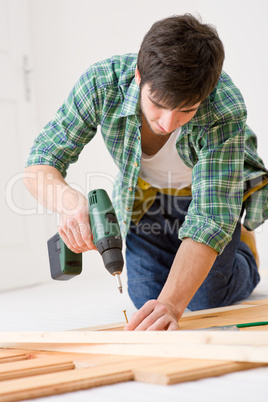 Home improvement - handyman installing wooden floor