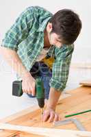 Home improvement - handyman installing wooden floor