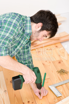 Home improvement - handyman installing wooden floor