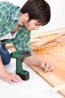 Home improvement - handyman installing wooden floor