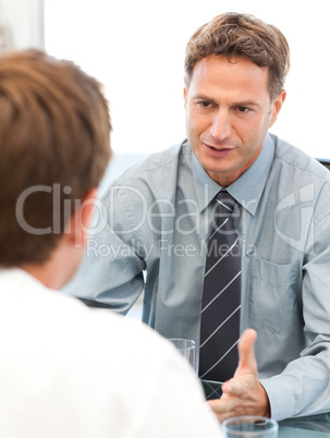 Charismatic manager during a meeting with an employee