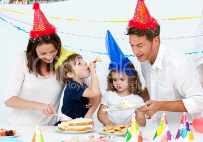 Beautiful mom serving a birthday cake to her family