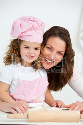 Portrait of a mother and daughter at a table