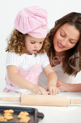 Little girl preparing a daught with her mother