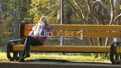 Young girl on park bench