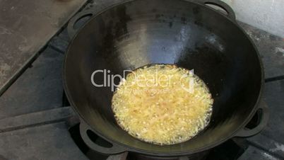Frying onion in Wok