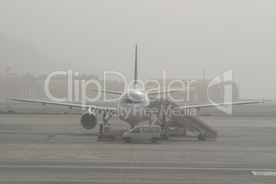 Airplane Stuck In Fog on Runway at Airport
