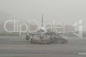 Airplane Stuck In Fog on Runway at Airport