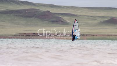 Man wind surfing.