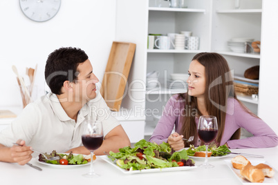 Young couple talking during their lunch