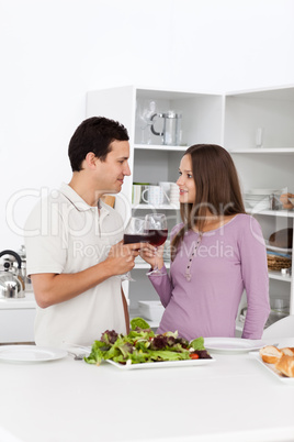 Young couple giving a toast during the lunch