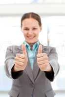 Successful businesswoman doing thumbs up