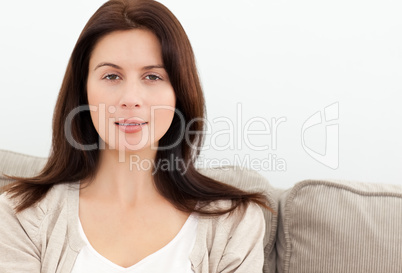 Serene woman sitting on the sofa