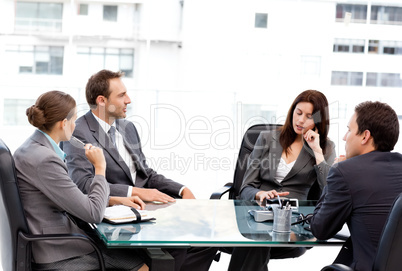Thoughtful businesswoman talking to her team during a meeting