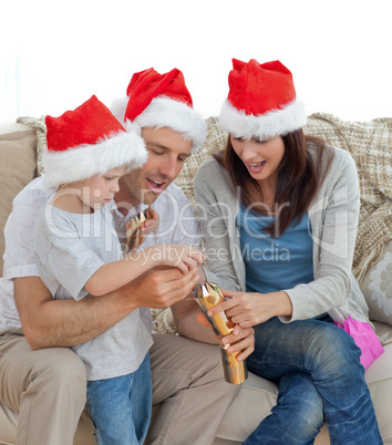 Happy parents with thir opening crackers together