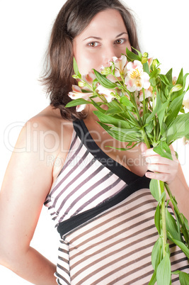 Portrait of pretty pregnant woman with flowers
