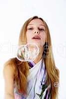 Attractive girl with soap bubbles