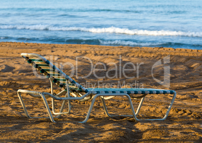 Olf sun lounger on beach