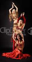 Three young woman  dance in arabic costume