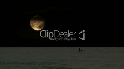 Lone fisherman with huge full moon 1