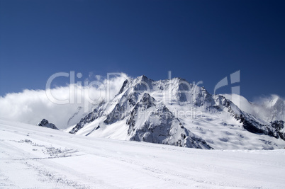 Ski slope against mountains