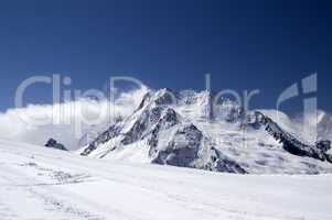 Ski slope against mountains