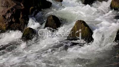 summer spring and stones force flowing waterfall