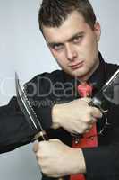 man with two knifes in hands